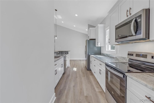 kitchen with baseboards, light wood-style flooring, recessed lighting, white cabinets, and appliances with stainless steel finishes