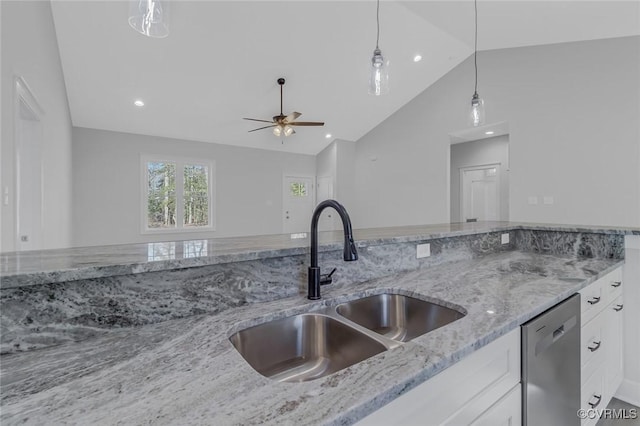 kitchen with pendant lighting, dishwasher, light stone counters, white cabinetry, and a sink