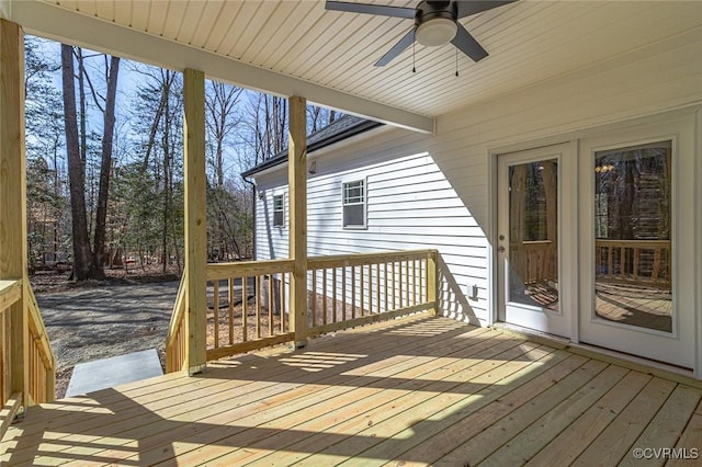 wooden terrace with a ceiling fan