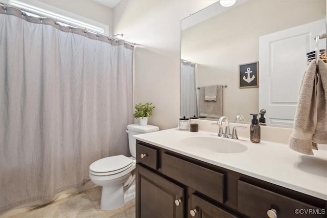 full bathroom featuring toilet and vanity