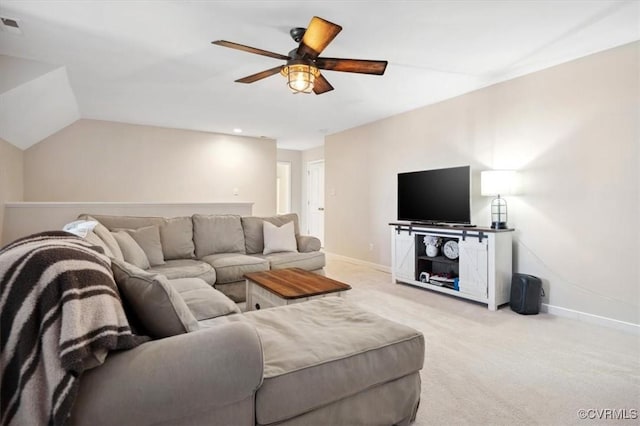 living room with light carpet, ceiling fan, baseboards, and vaulted ceiling