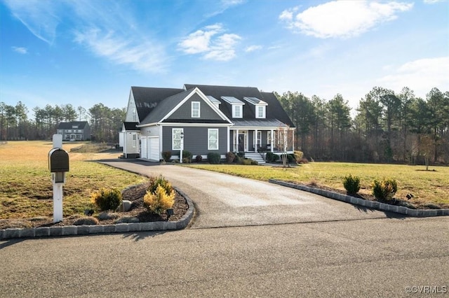 view of front of property with a front lawn and driveway