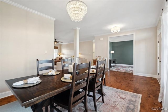 dining area featuring wood finished floors, baseboards, ornate columns, and ornamental molding