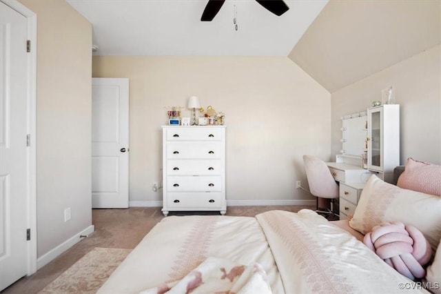 bedroom featuring ceiling fan, vaulted ceiling, baseboards, and light carpet