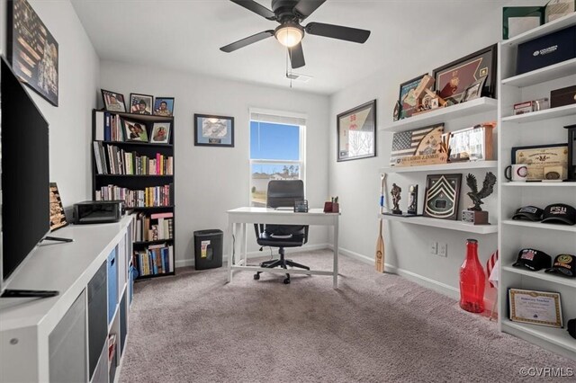 office area featuring baseboards, carpet floors, and ceiling fan