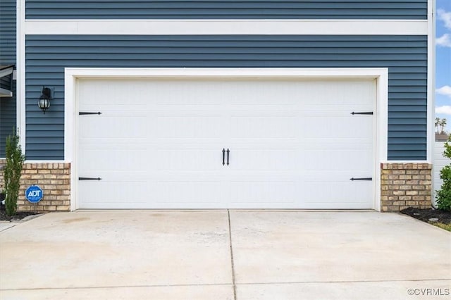 garage featuring driveway