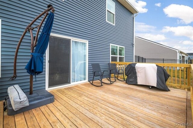 wooden deck featuring grilling area