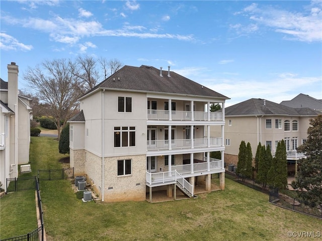 rear view of property featuring cooling unit, a fenced backyard, a yard, crawl space, and a balcony