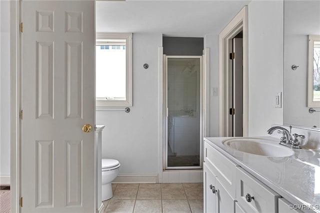 full bath featuring baseboards, toilet, a stall shower, tile patterned floors, and vanity