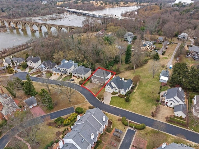 aerial view with a residential view and a water view