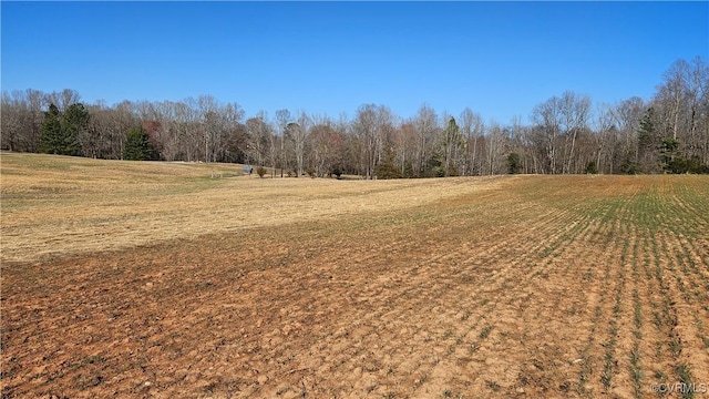 exterior space featuring a view of trees and a rural view