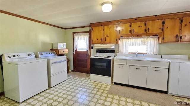 kitchen with electric stove, separate washer and dryer, light floors, and white microwave