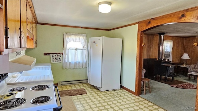 kitchen with white appliances, wooden walls, light floors, arched walkways, and crown molding