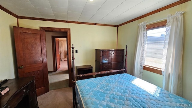 carpeted bedroom with ornamental molding