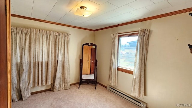 unfurnished room featuring baseboards, a baseboard heating unit, carpet, and ornamental molding