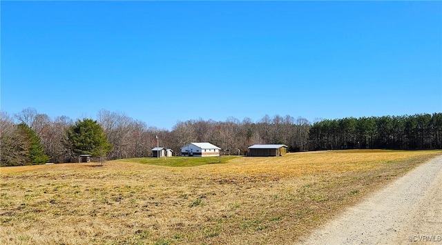 view of street featuring a rural view and a forest view