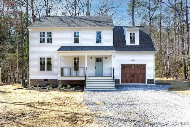 view of front of property with central AC unit, driveway, a porch, an attached garage, and crawl space