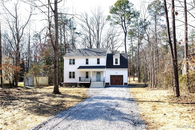 modern inspired farmhouse with an outbuilding, driveway, a porch, a shed, and crawl space