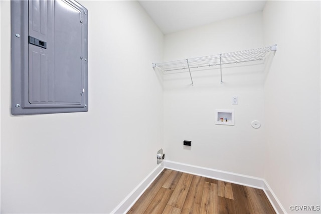 washroom featuring washer hookup, laundry area, electric panel, and baseboards