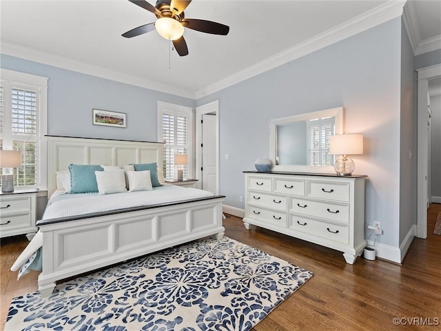 bedroom with crown molding, dark wood-style floors, baseboards, and ceiling fan