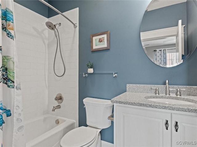 bathroom with toilet, shower / bath combo with shower curtain, and vanity