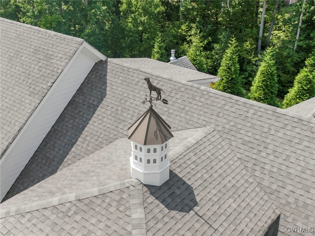 exterior details with a shingled roof