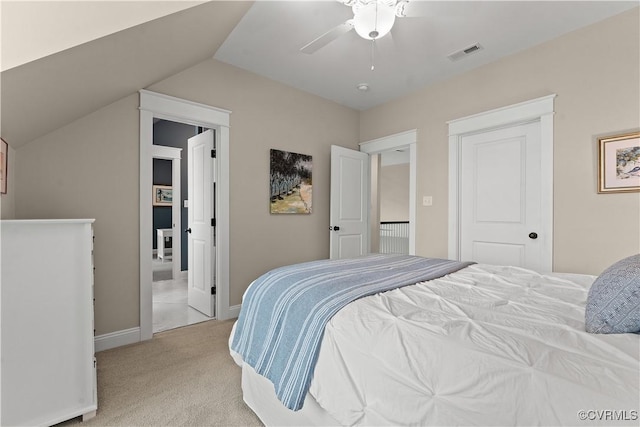 bedroom with visible vents, a ceiling fan, baseboards, light colored carpet, and vaulted ceiling