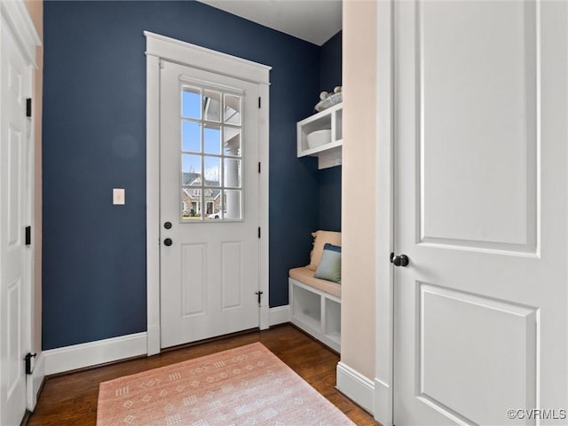 mudroom featuring wood finished floors and baseboards