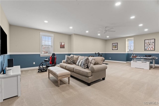 living area with recessed lighting, baseboards, light colored carpet, and a ceiling fan