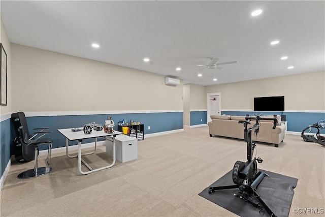 exercise area with a wall mounted air conditioner, baseboards, and recessed lighting