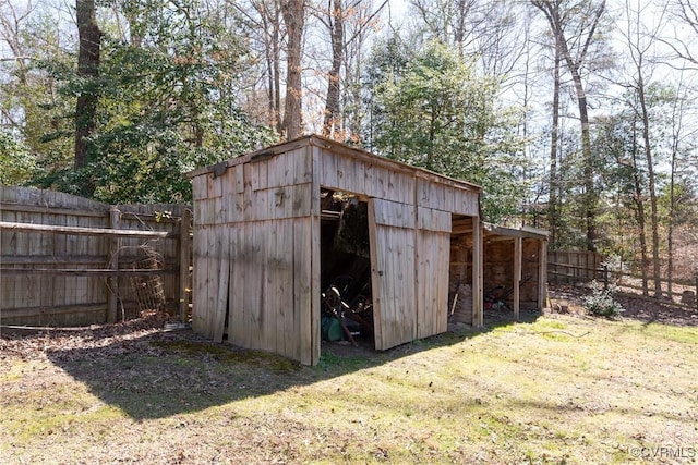 view of pole building with fence