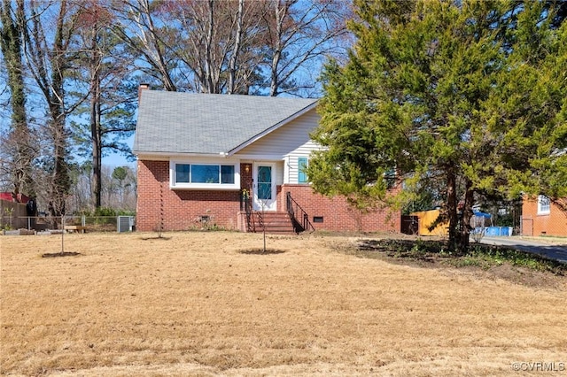 view of front facade featuring central air condition unit, fence, crawl space, brick siding, and a chimney