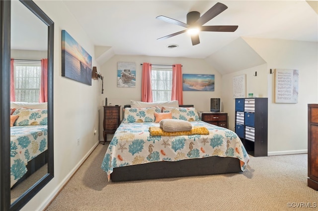 bedroom featuring visible vents, baseboards, carpet, lofted ceiling, and ceiling fan