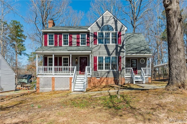 view of front of house featuring crawl space, covered porch, a chimney, and a shingled roof