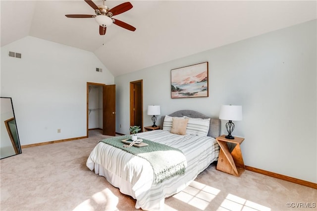 bedroom with vaulted ceiling, baseboards, visible vents, and light carpet