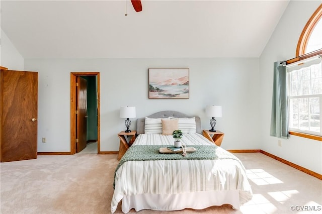 carpeted bedroom featuring ceiling fan, baseboards, and lofted ceiling