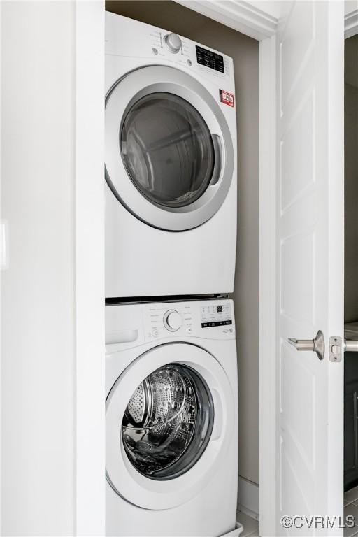 laundry room featuring laundry area and stacked washing maching and dryer