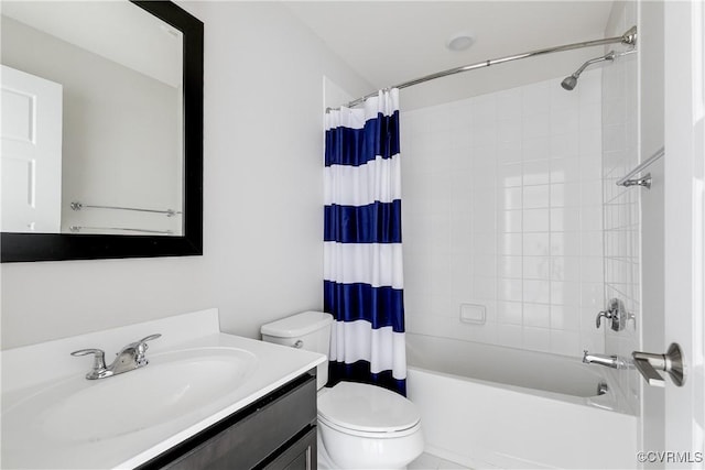 bathroom with toilet, vanity, and shower / bath combo