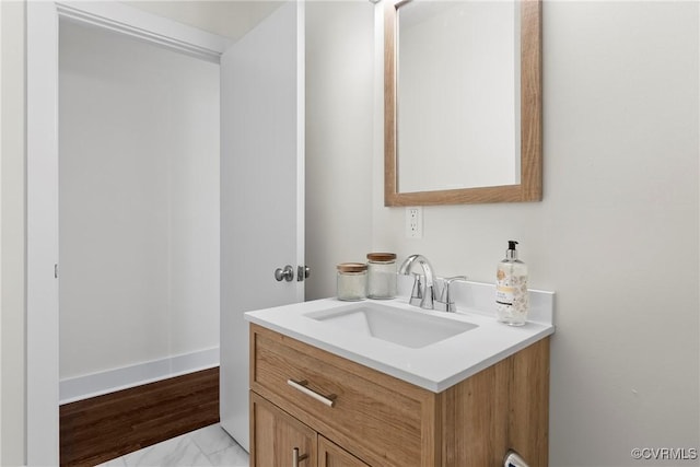 bathroom featuring vanity and baseboards