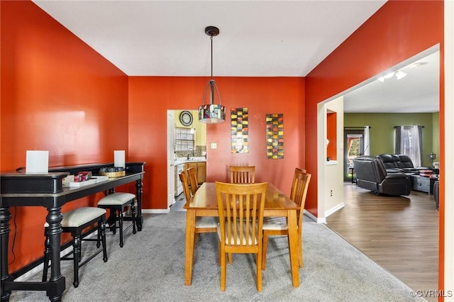 dining room with baseboards and wood finished floors