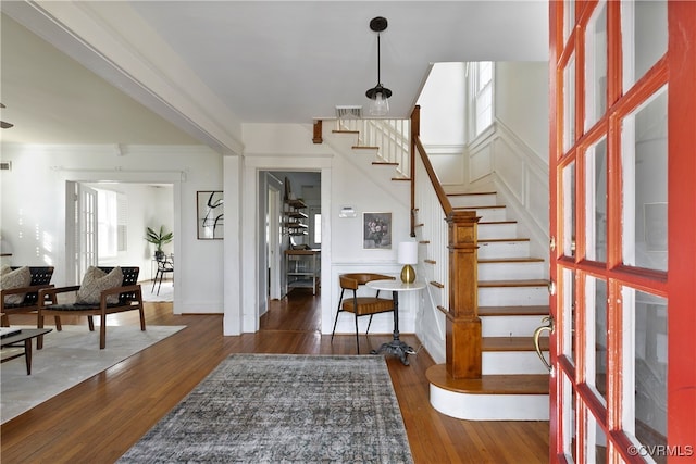 foyer featuring stairs and hardwood / wood-style flooring