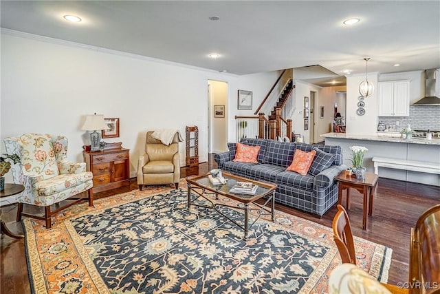 living area with recessed lighting, stairway, light wood-style flooring, and ornamental molding