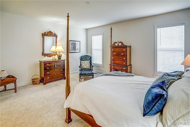 bedroom featuring baseboards and carpet floors