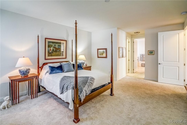 bedroom with baseboards and carpet floors