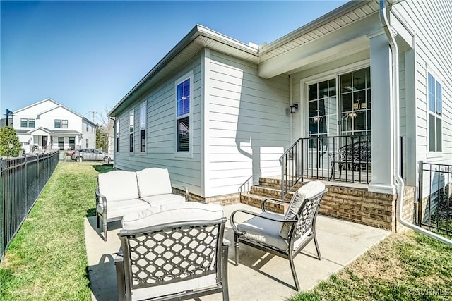 view of patio with outdoor lounge area and fence