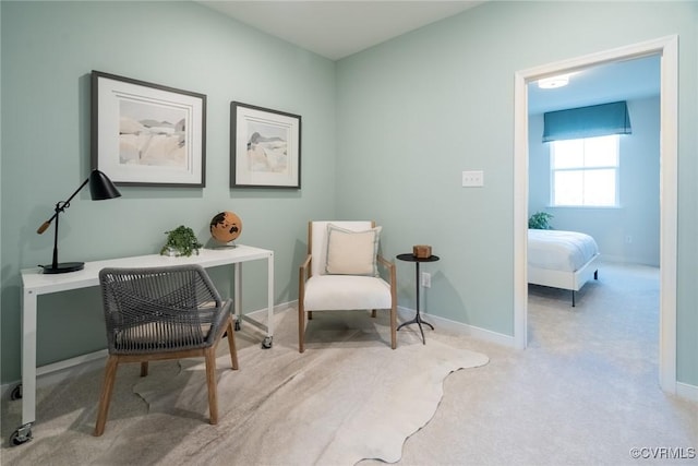 living area with carpet and baseboards