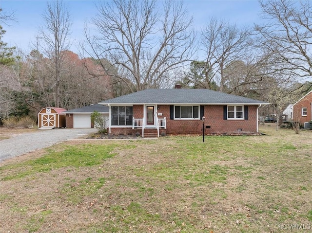 ranch-style house with brick siding, a front yard, a chimney, an outdoor structure, and crawl space