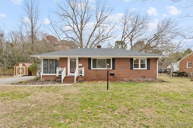 ranch-style house with a storage shed, an outbuilding, brick siding, and crawl space