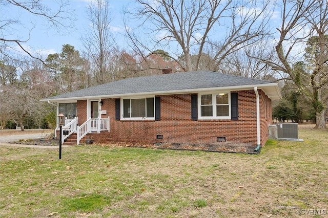 ranch-style house with crawl space, brick siding, central AC, and a front yard