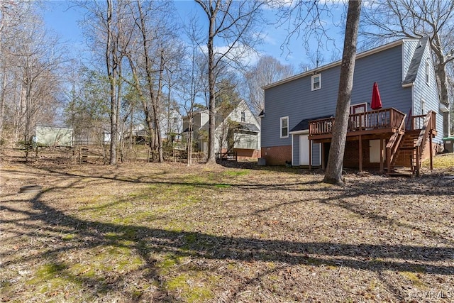 view of yard featuring stairway and a deck